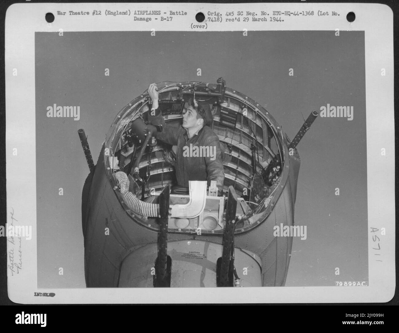 Charles Novak Machinist Mate 3Rd Class Usn Examines The Remains Of 