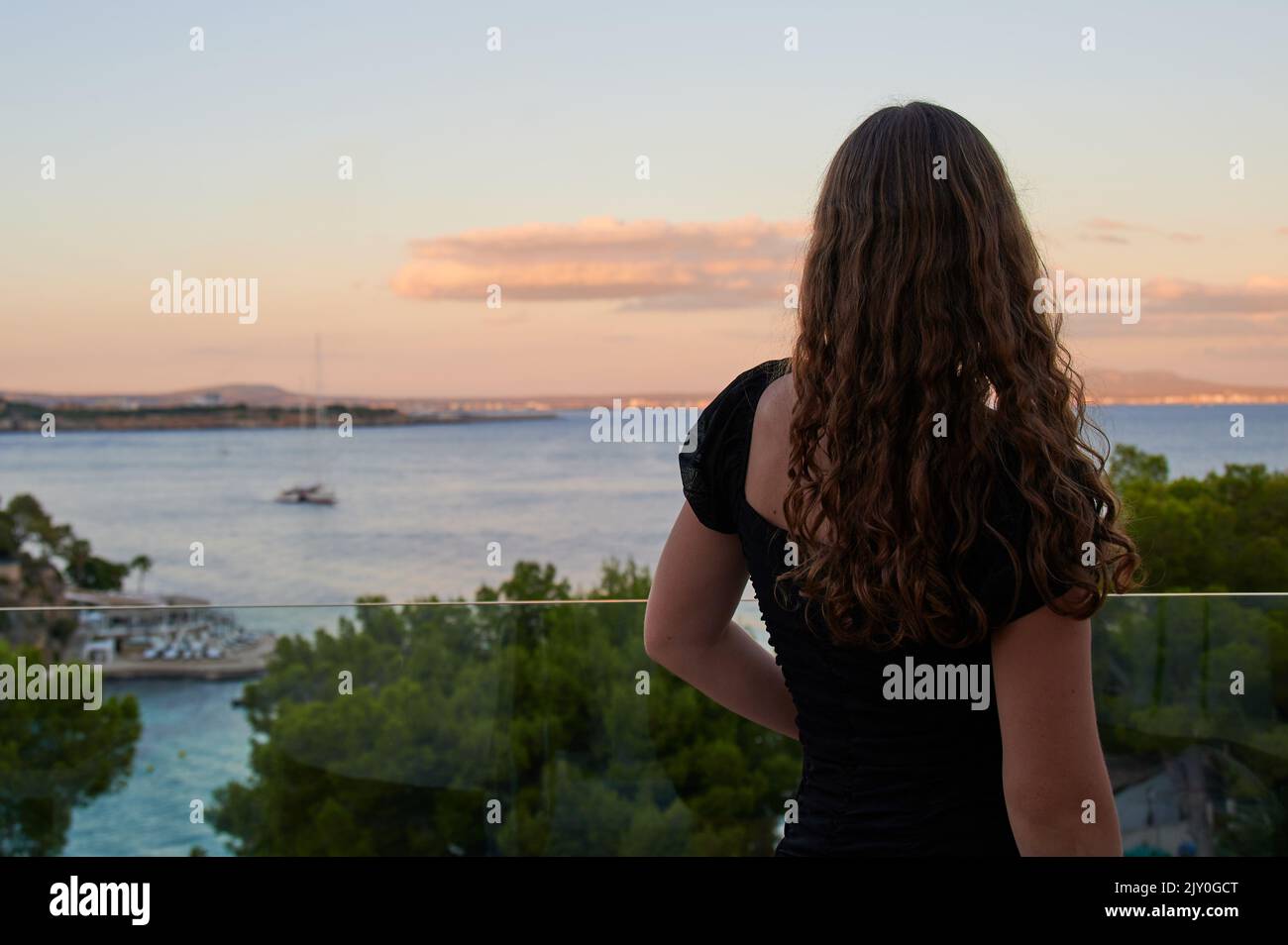 not recognizable girl is looking to the sea in front of Illetas, Majorca Stock Photo