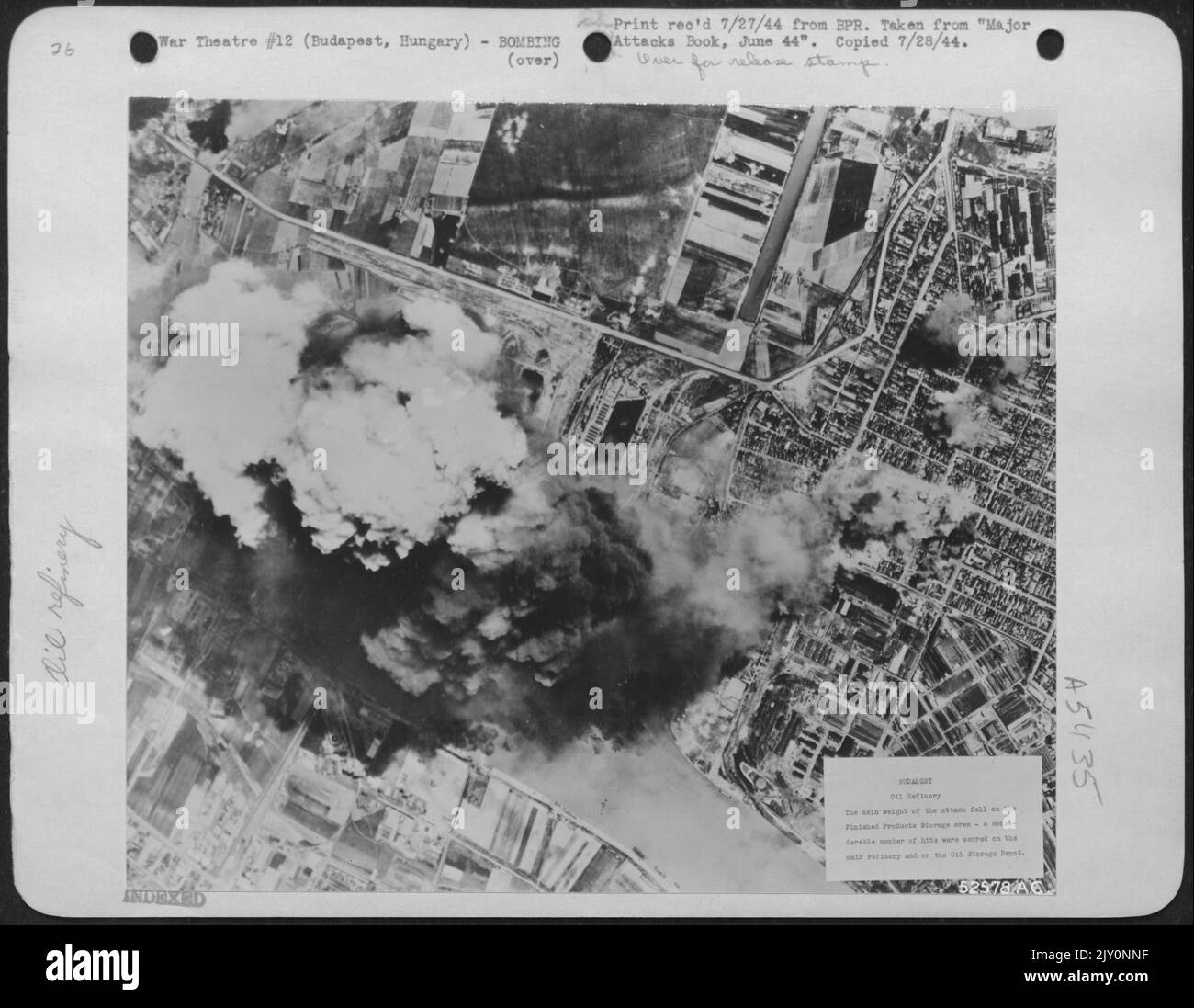 The main weight of the attack fell on the Finished Products Storage area.-A considerable number of hits were scored on the main refinery and on the Oil Storage Depot.-Budapest, Hungary. Stock Photo