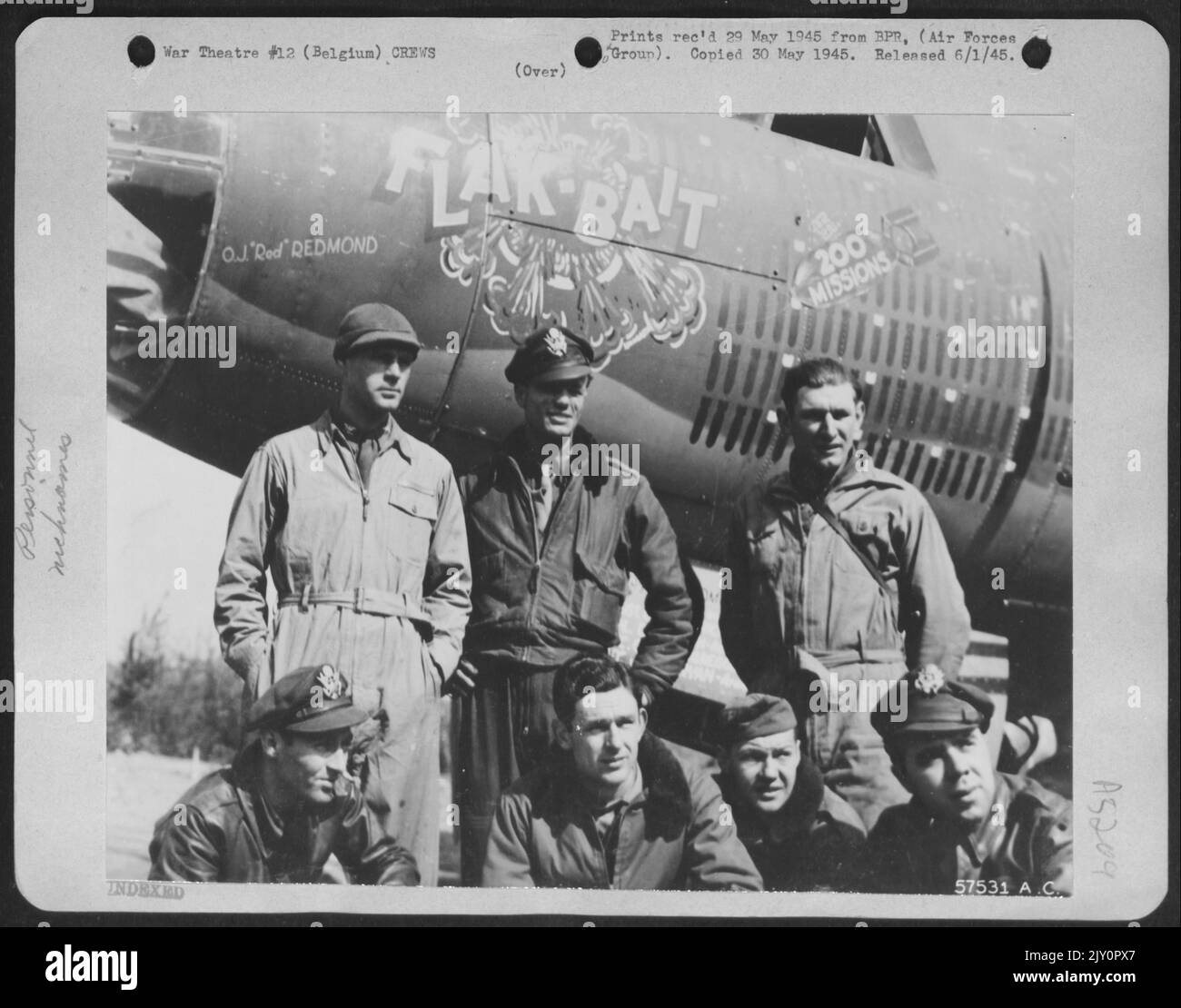 The Crew Of 'Flak Bait', First Martin B-26 Marauder To Complete 200 Missions In This Theater Is Shown By The Battle-Scarred Bomber Just After Completing Its 200Th Mission. They Are, Front Row, Left To Right: 1St. Lt. William D. Brearly, Of New York, Bomb Stock Photo