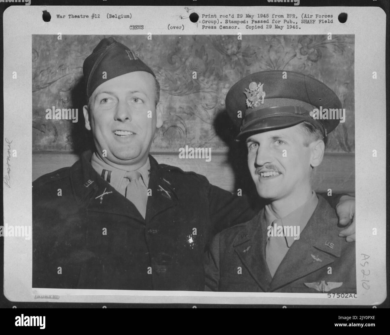Belgium -- Capt. Thomas E. Mccracken (Left), Ground Liaison Officer At A Combat Wing Of The 9Th Bombardment Division, Who Liberated His Brother, 2Nd Lt. James B. Mccraken (Right), A 'Flying Fortress' Bombardier, Who Was Interned By The Nazis For More Than Stock Photo