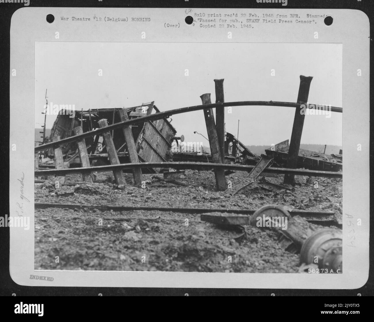 Railroad cars, rails and roadbeds smashed and ripped by 9th AF fighter-bombers during an attack on an enemy railroad yard along the Belgian-German borders as part of a coordinated plan to snarl German railroad communications by the three Tactical Air Stock Photo