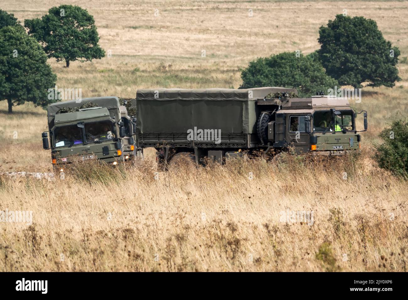 British army MAN HX60 4x4 Heavy Utility Trucks in action on a military ...
