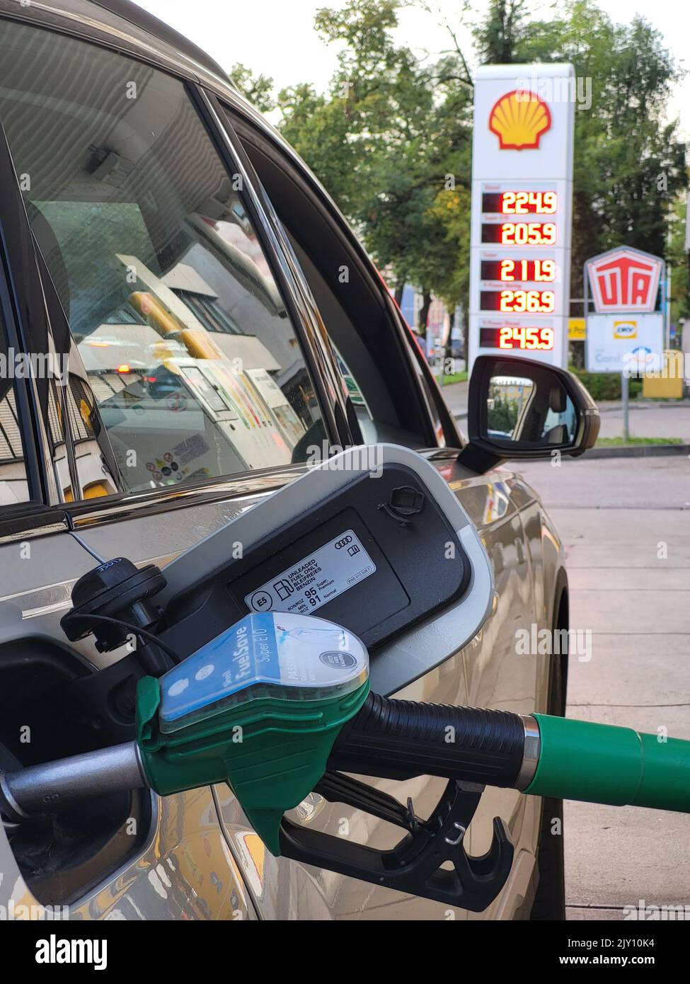 MUNICH, GERMANY - SEPTEMBER 7: Car getting fueled at a Shell gas station in Munich with gas prices above 2 Euro on September 7, 2022 in Munich Stock Photo