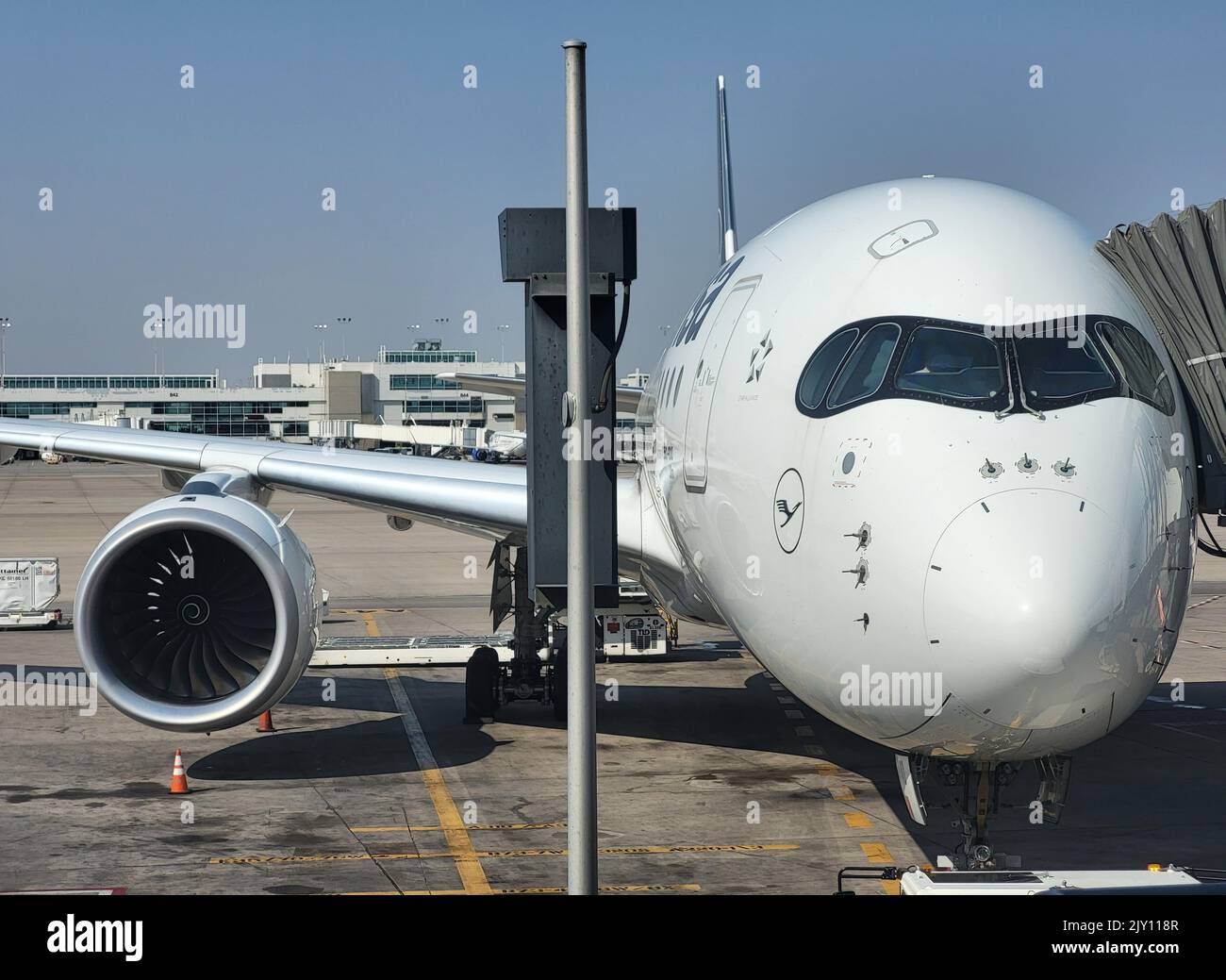 MUNICH, GERMANY - SEPTEMBER 7: Lufthansa Airbus wing with docked Lufthansa planes at the Gates of Munich Airport on September 7, 2022 in Munich Stock Photo