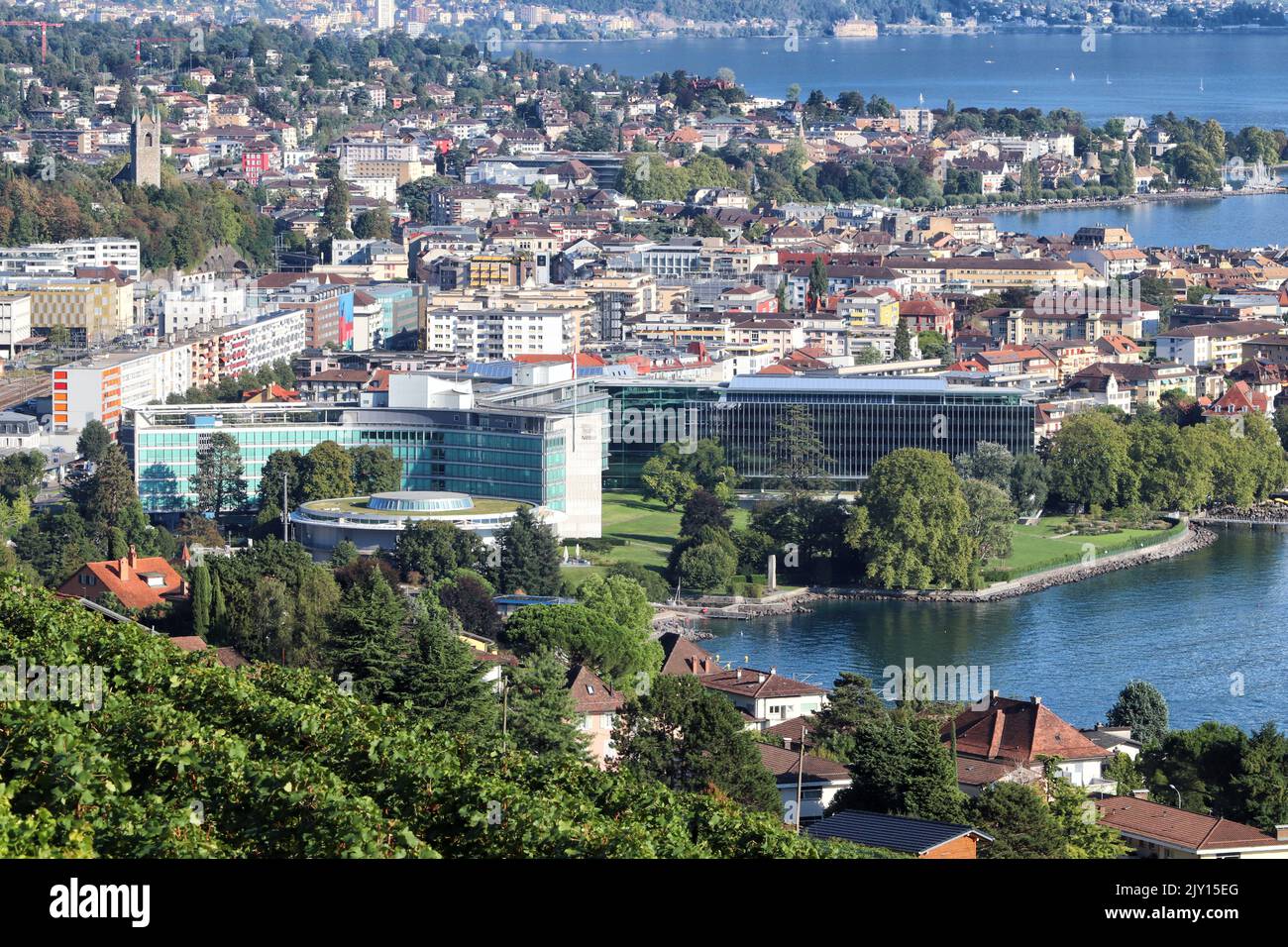 Vevey, Switzerland - September 4, 2022: Nestle headquarters office buildings are seen from the top of the mountain. Stock Photo