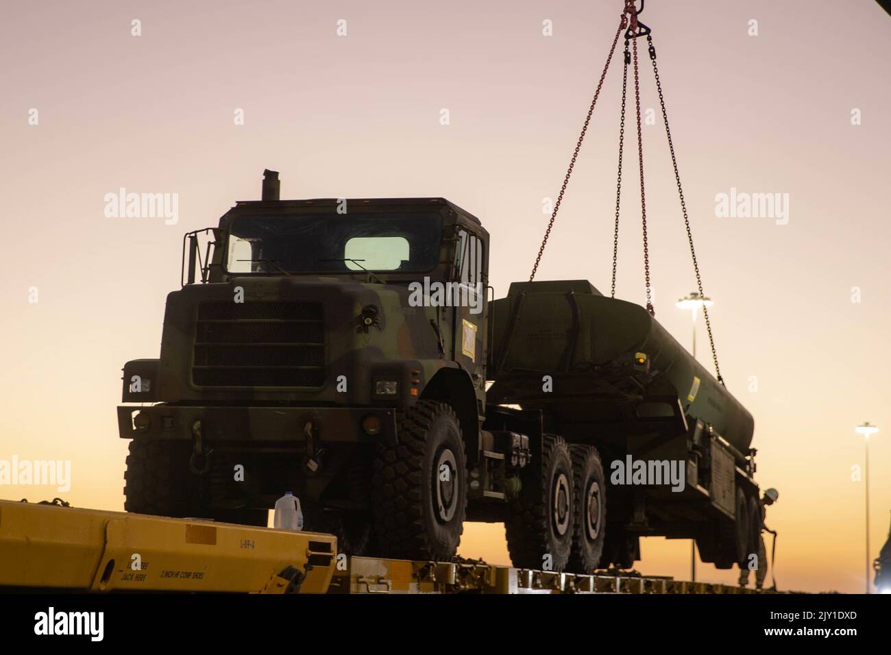 U.S. Marines with 2nd Transportation Battalion (TB), Combat Logistics Regiment 27, 2nd Marine Logistics Group, lift a M970 Semitrailer Refueler with a Terex-Demag MAC 50 All-Terrain Crane at the Mesquite Regional Landfill Railyard in Glamis, California, Aug. 27, 2022. 1st Landing Support Battalion and 2nd Transportation Battalion led railhead operations from August 26 to September 1, 2022, in order to deliver logistical support for Weapons and Tactics Instructor Course 1-23 being conducted at Marine Corps Air Station Yuma in Yuma, Arizona. (U.S. Marine Corps photo by Lance Cpl. Sixto Castro) Stock Photo