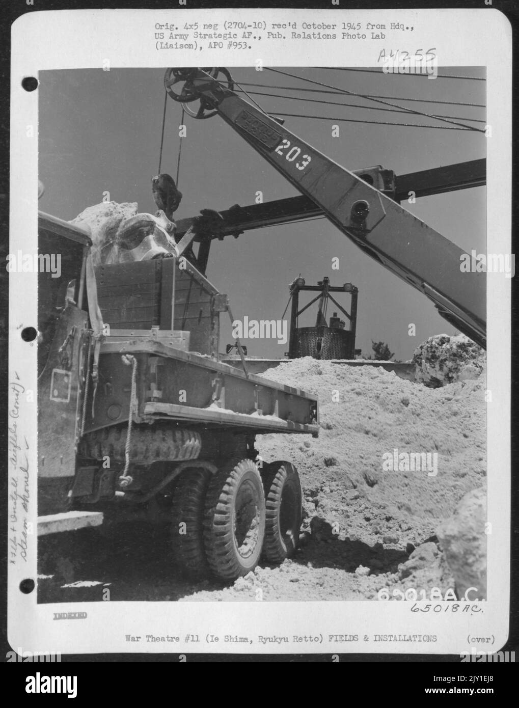 Steam Shovel Filling Dump Truck With Crushed Coral At Coral Pit On Ie Shima, Ryukyu Retto. Stock Photo