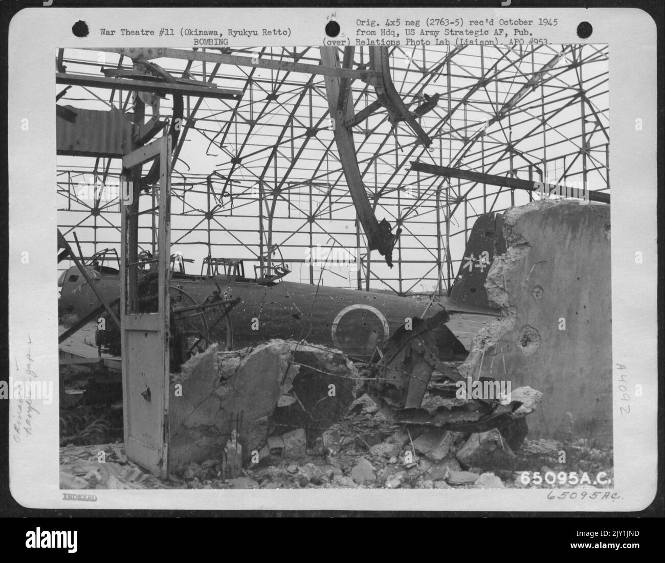 Twisted Steel Framework Of Hangar And A Demolished Aircraft Which The U