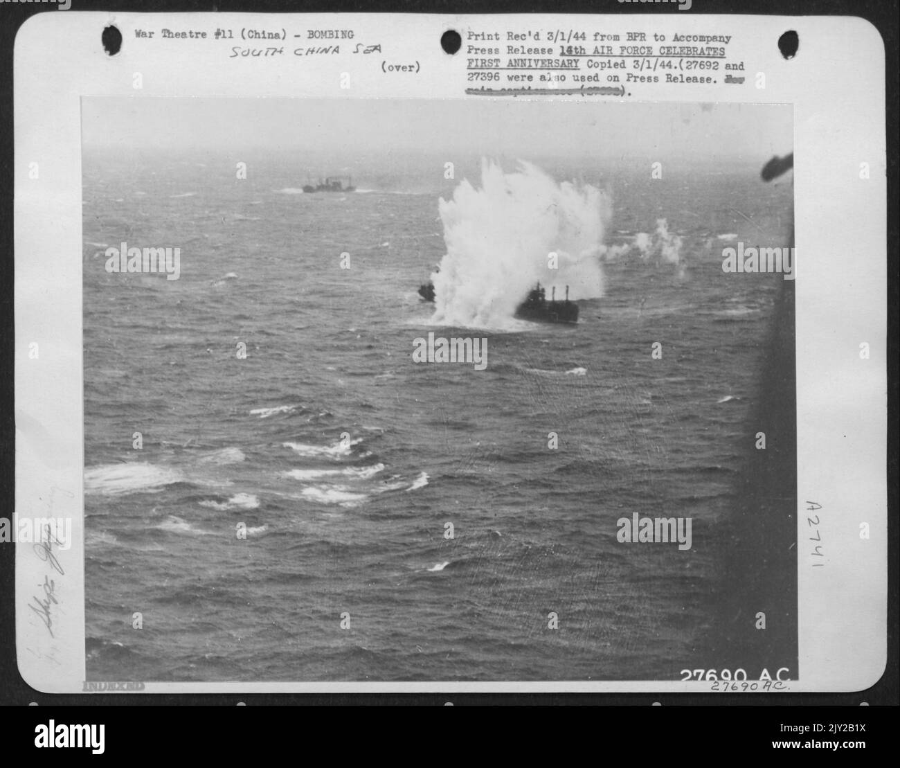 This Japanese freighter, a 4400-ton single stack armed cargo vessel, somewhere off the China coast is the target of bombs dropped from a B-25 bomber of the U.S. Army 14th Air force making a South China Sea Sweep. The ship sank. Stock Photo