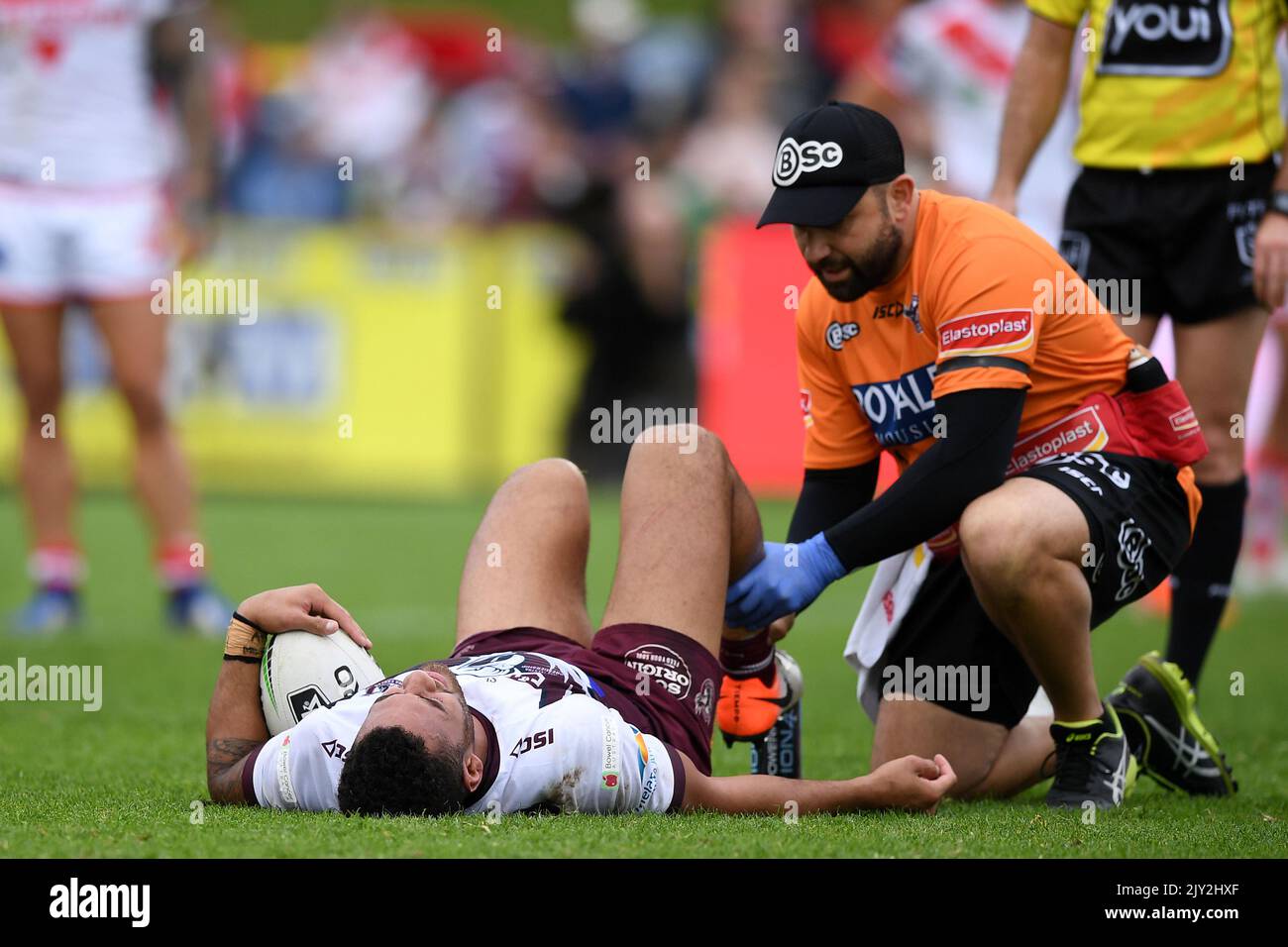 Apisai Koroisau of the Sea Eagles receives treatment for an injury