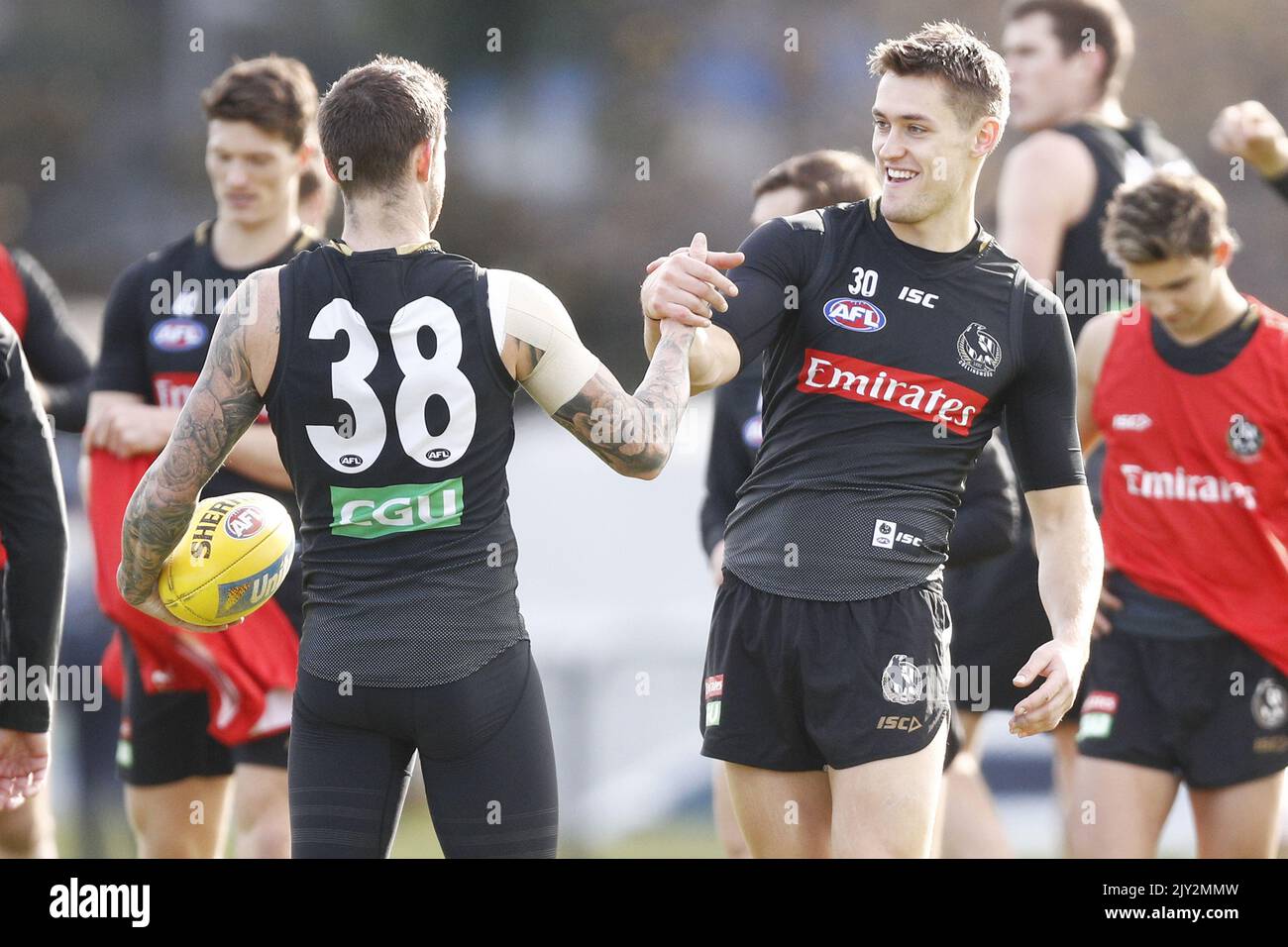 Darcy Moore (right) hugs Jeremy Howe during a Collingwood Magpies