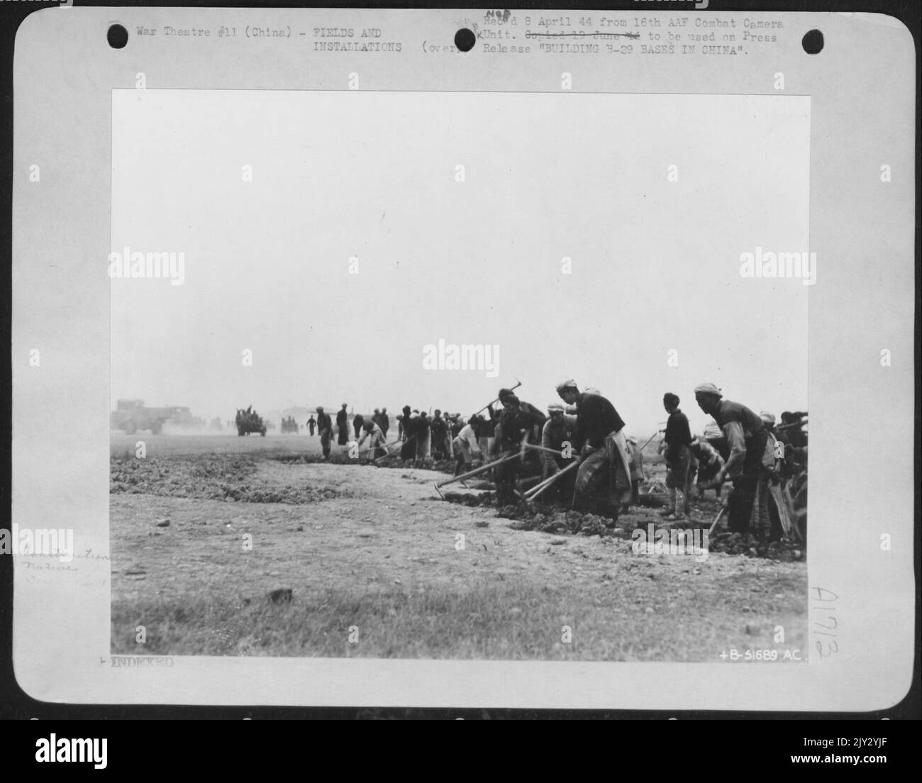 BUILDING B-29 BASES IN CHINA by USAAF aviation engineers and native laborers. Landing strips were constructed on rice fields and paddies, bought from Chinese farmers. Then the farmers themselves and neighboring townspeople pitched in to do the work. Stock Photo