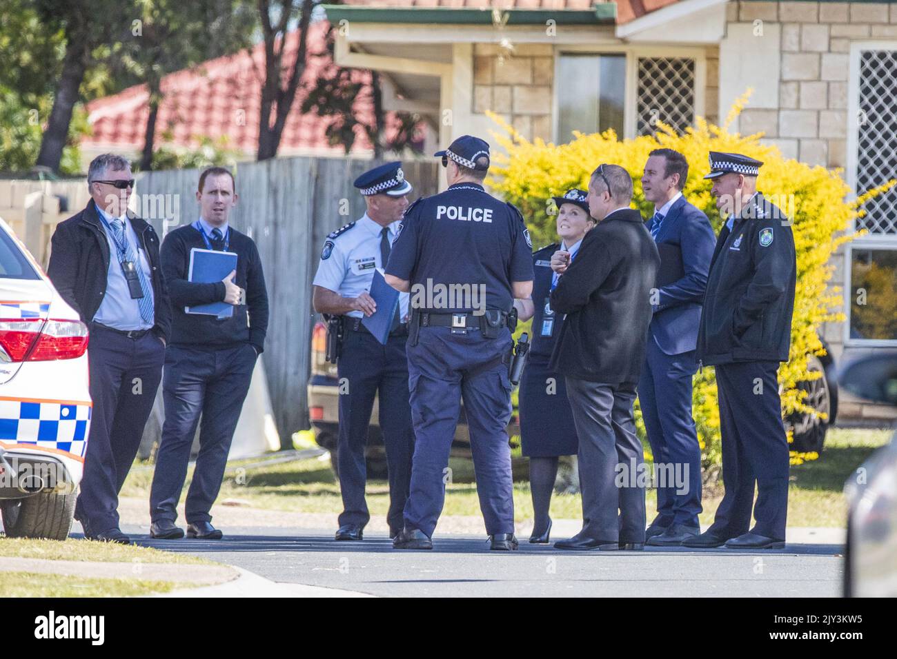 Police and forensic police are seen at a crime scene in Cassowary St