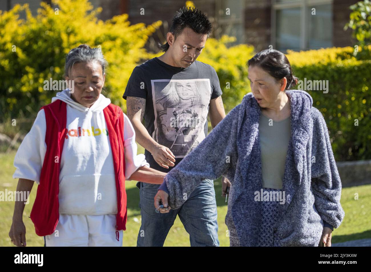 Relatives of a man shot by police are seen at the crime scene in ...