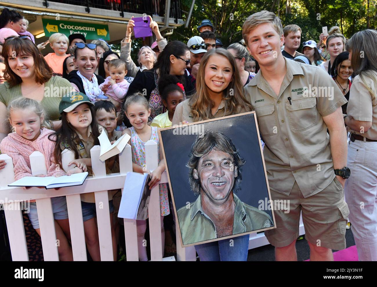 Bindi Irwin and Robert Irwin are seen holding a portrait of their late(02)