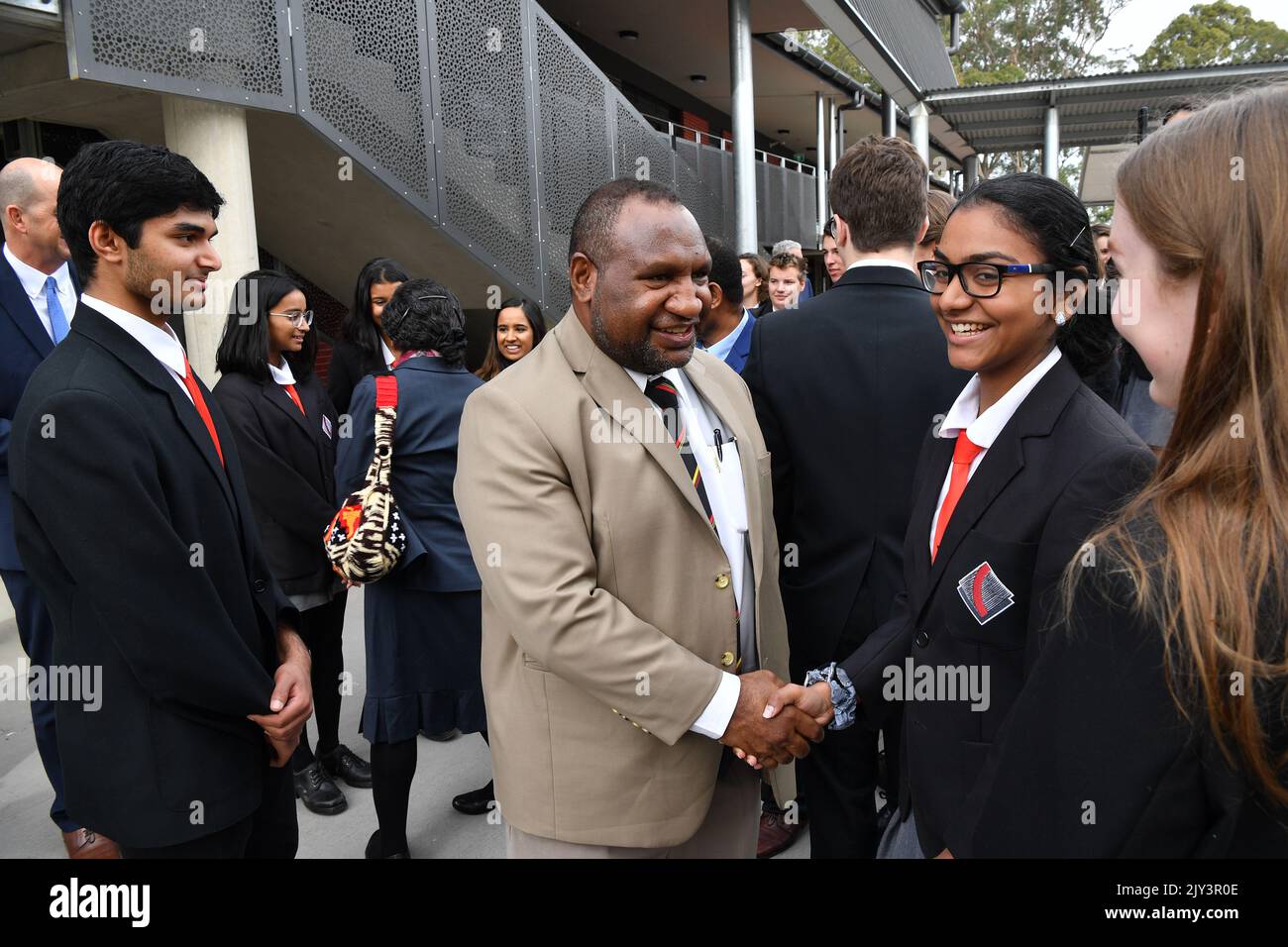 Papua New Guinea Prime Minister James Marape farewells students during