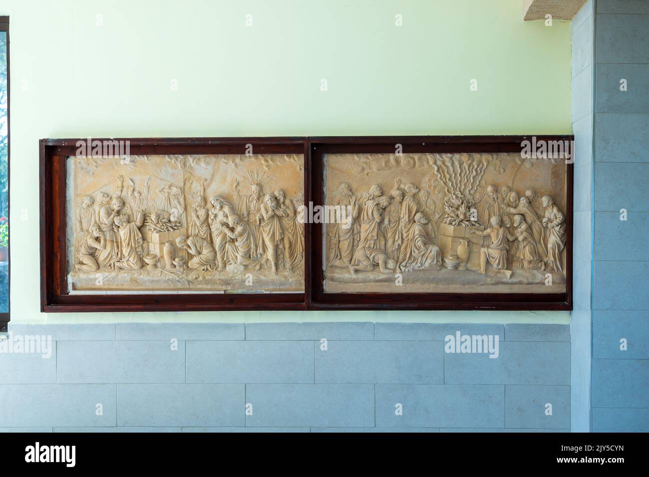 HAIFA, ISRAEL. June 26, 2022: Muhraka monastery of the Carmelite on the Carmel mount . Bas-relief depicting the priests of Baal at the altar and proph Stock Photo