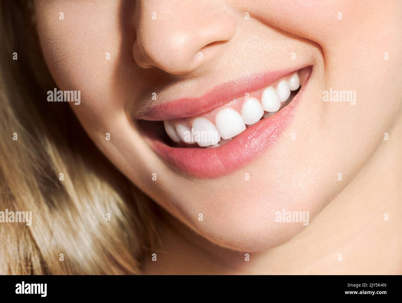 Perfect healthy teeth smile of a young woman. Teeth whitening. Dental clinic patient. Image symbolizes oral care dentistry, stomatology Stock Photo