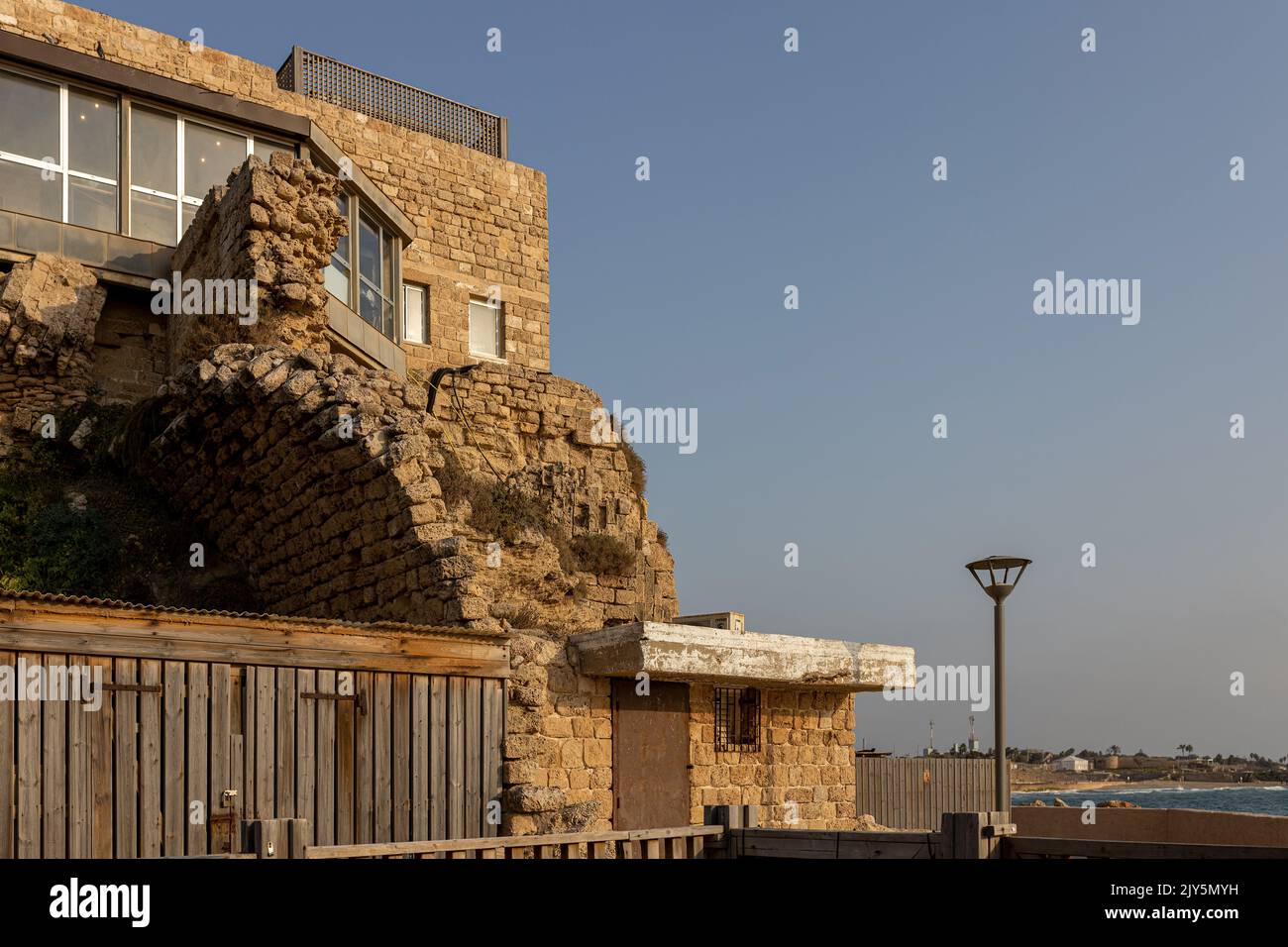 CAESAREA, Israel - August 11 2022:Tourists at Caesarea ancient port. The ancient Caesarea Maritima city and harbor was built by Herod the Great about Stock Photo