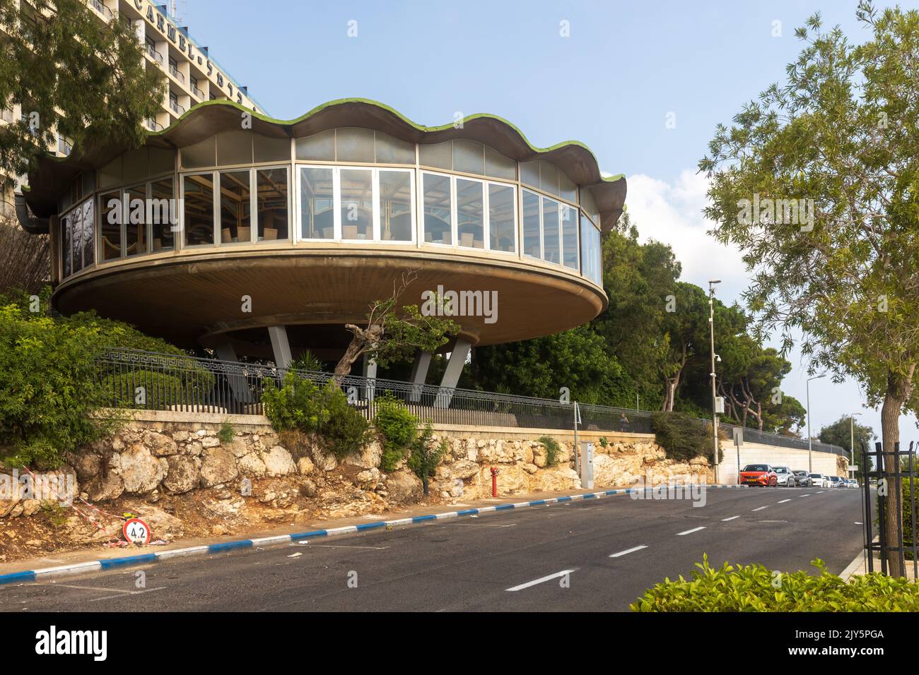 Haifa, Israel, AUGUST 23, 2022: The unique building of the Rondo restaurant on the footpath in the Louis Promenade near the Bahai Garden Stock Photo