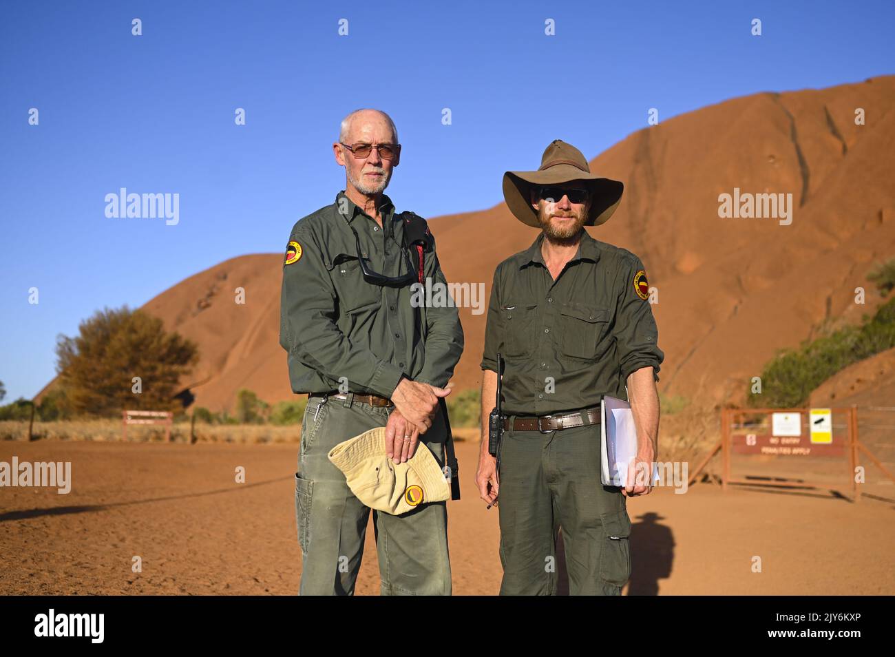 Uluru Rangers Uluru Kata-Tjuta Park ranger Greg Elliot (left) poses for photographs ...