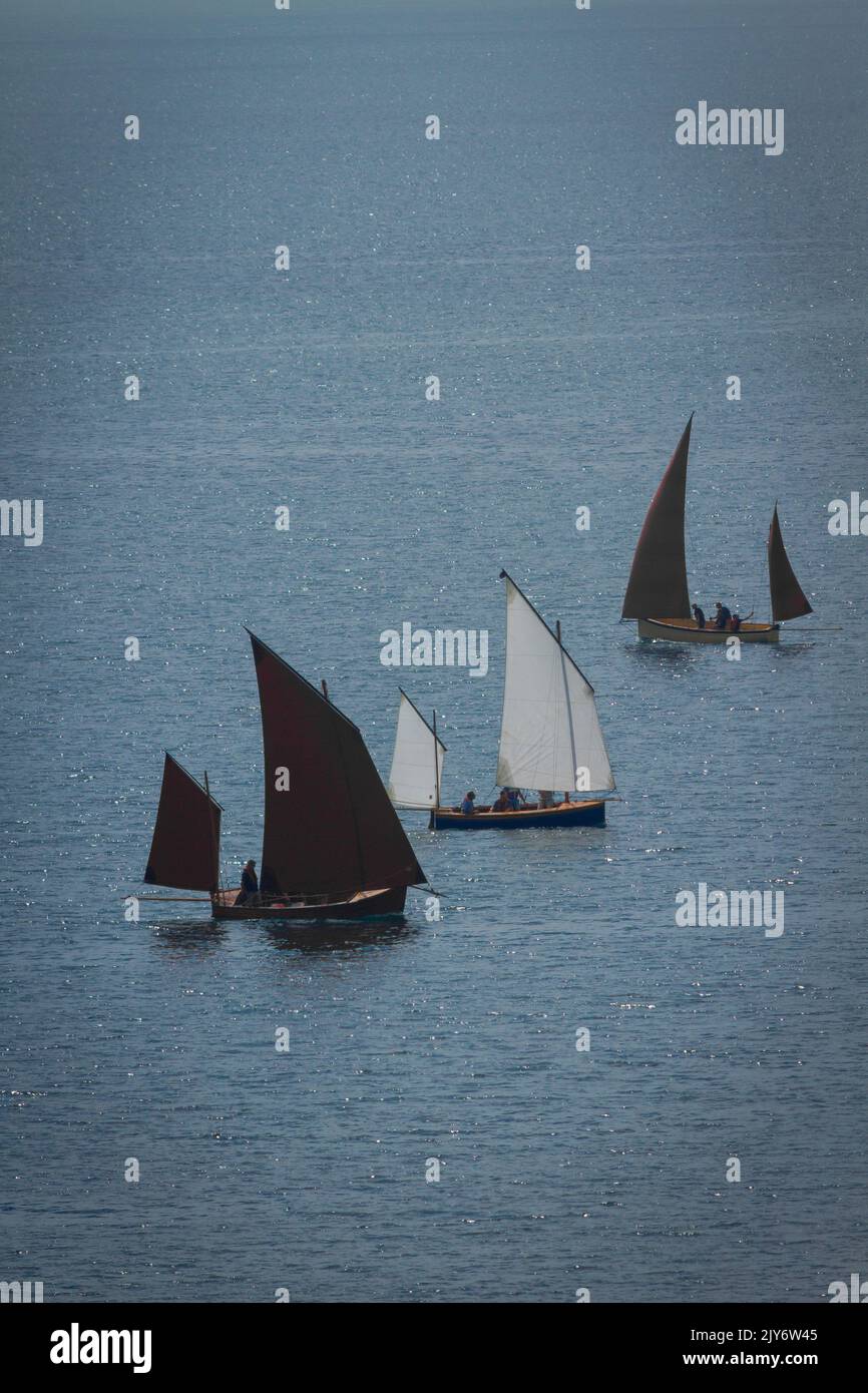 Sailing boats on East Devon coast near village of Beer Stock Photo