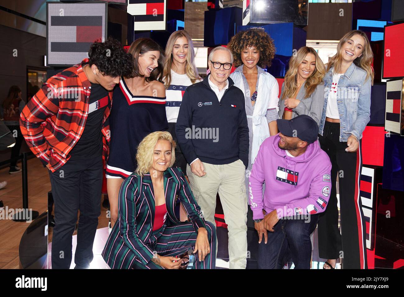 American fashion designer Tommy Hilfiger poses with Denzel, Isabella  Carlstrom, Moana Hope, Brooke Hogan, Nadia Bartel, Josh Gibson and fashion  models during an event at the Emporium in Melbourne, Friday, November 15,