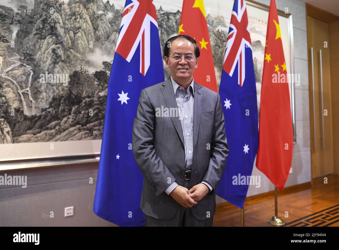 Chinese Ambassador to Australia Cheng Jingye poses for photographs