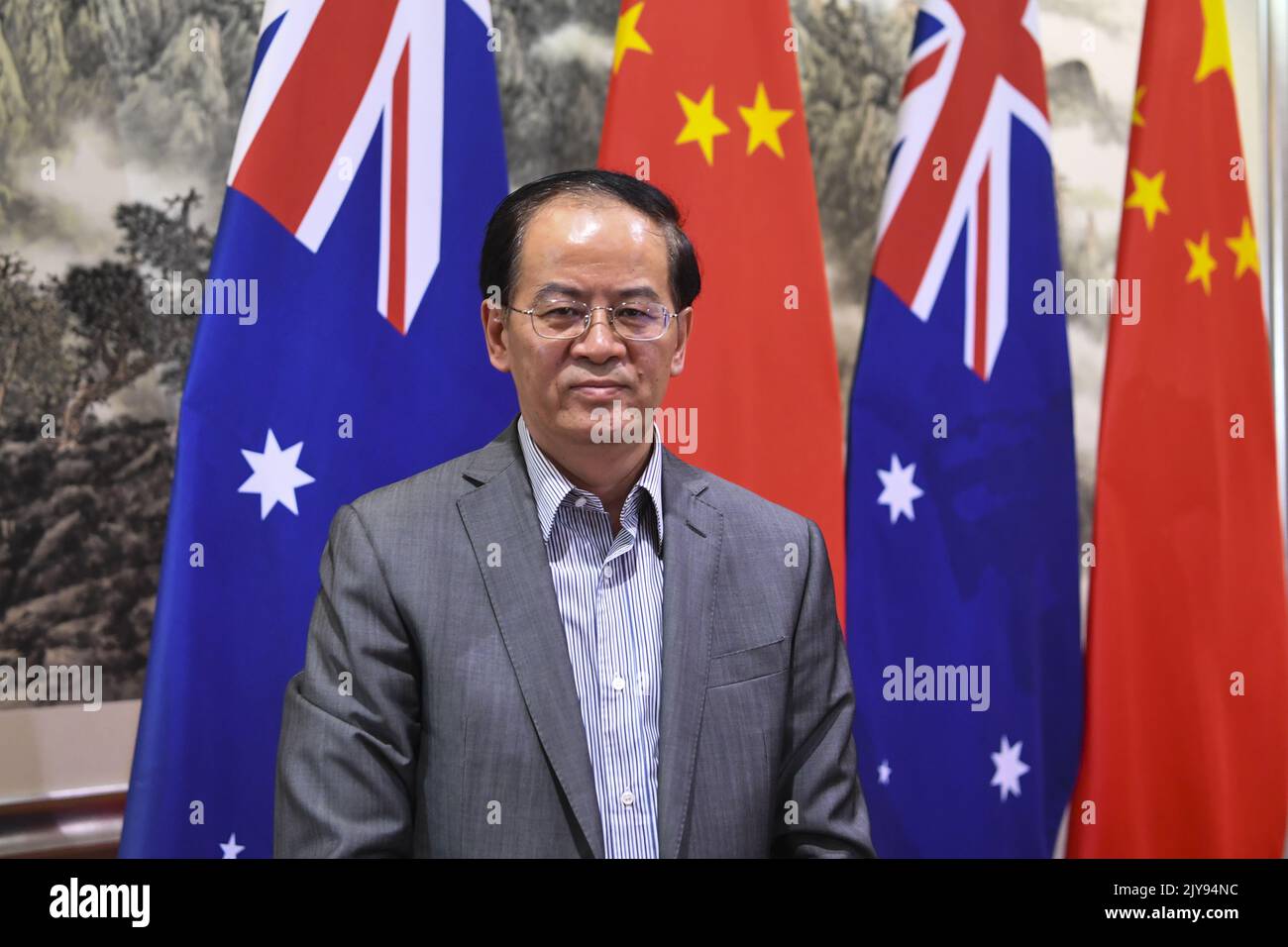 Chinese Ambassador to Australia Cheng Jingye poses for photographs