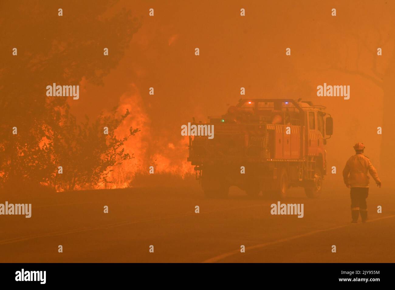 Rural Fire Service (RFS) crews attempt to control a blaze along the Old ...