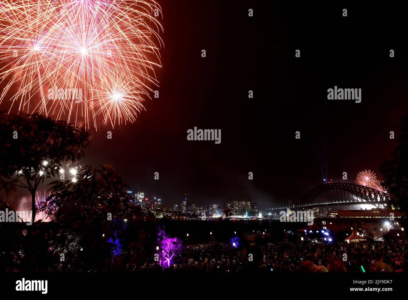 The 9pm Family fireworks explode over Sydney Harbour, as seen from Barangaroo Reserve, during