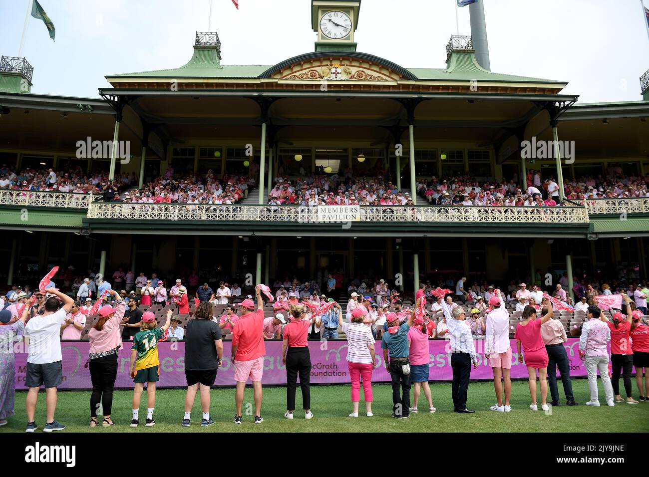 McGrath Foundation volunteers wave their pink bandannas on day 3 of the