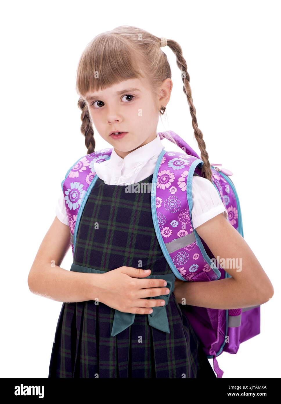 Adorable little schoolgirl with happy smile keeping arms crossed. Small ...