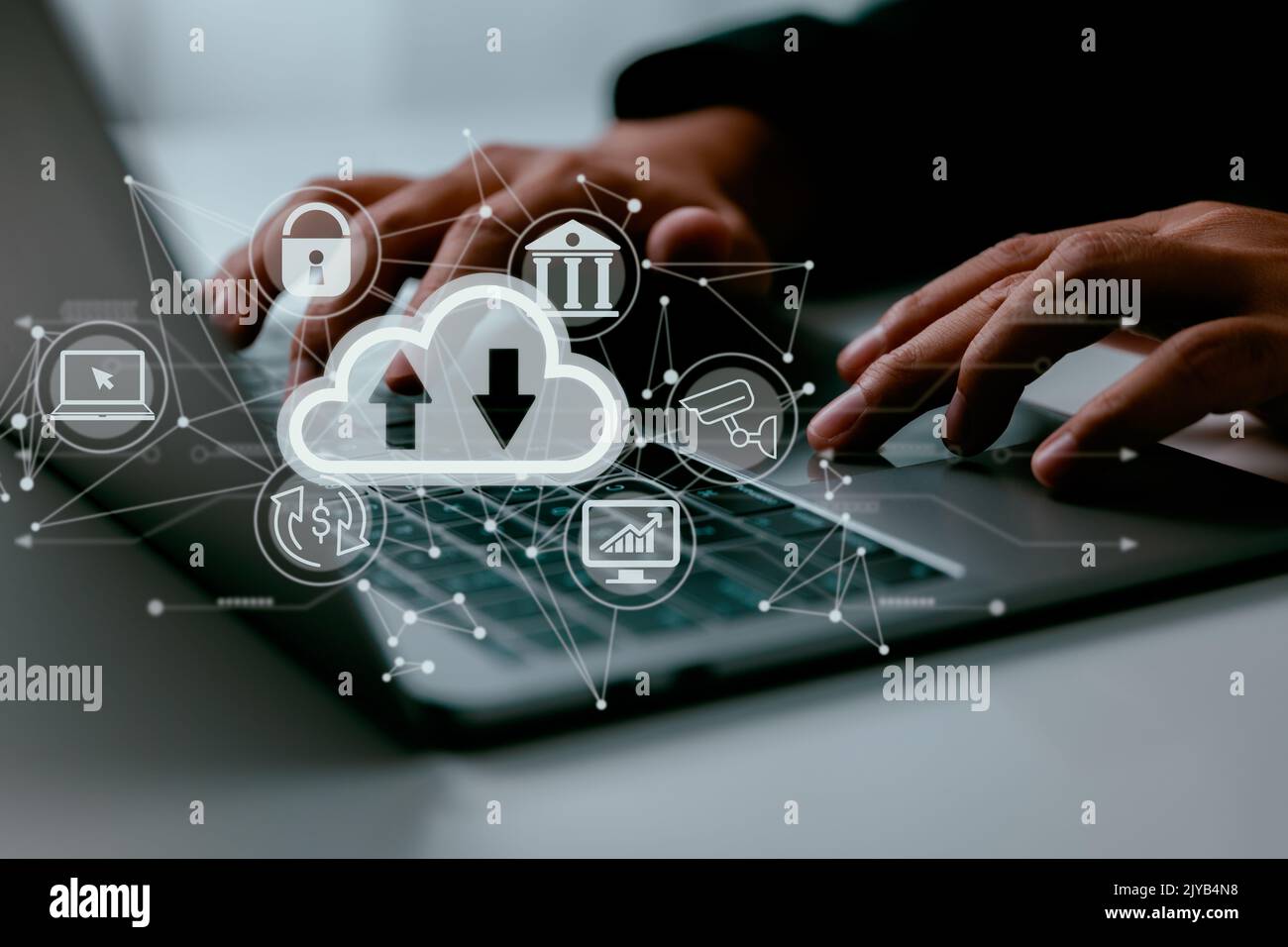 On a man's laptop is a cloud computing schematic. Cloud computing, data storage, and internet service ideas. Stock Photo