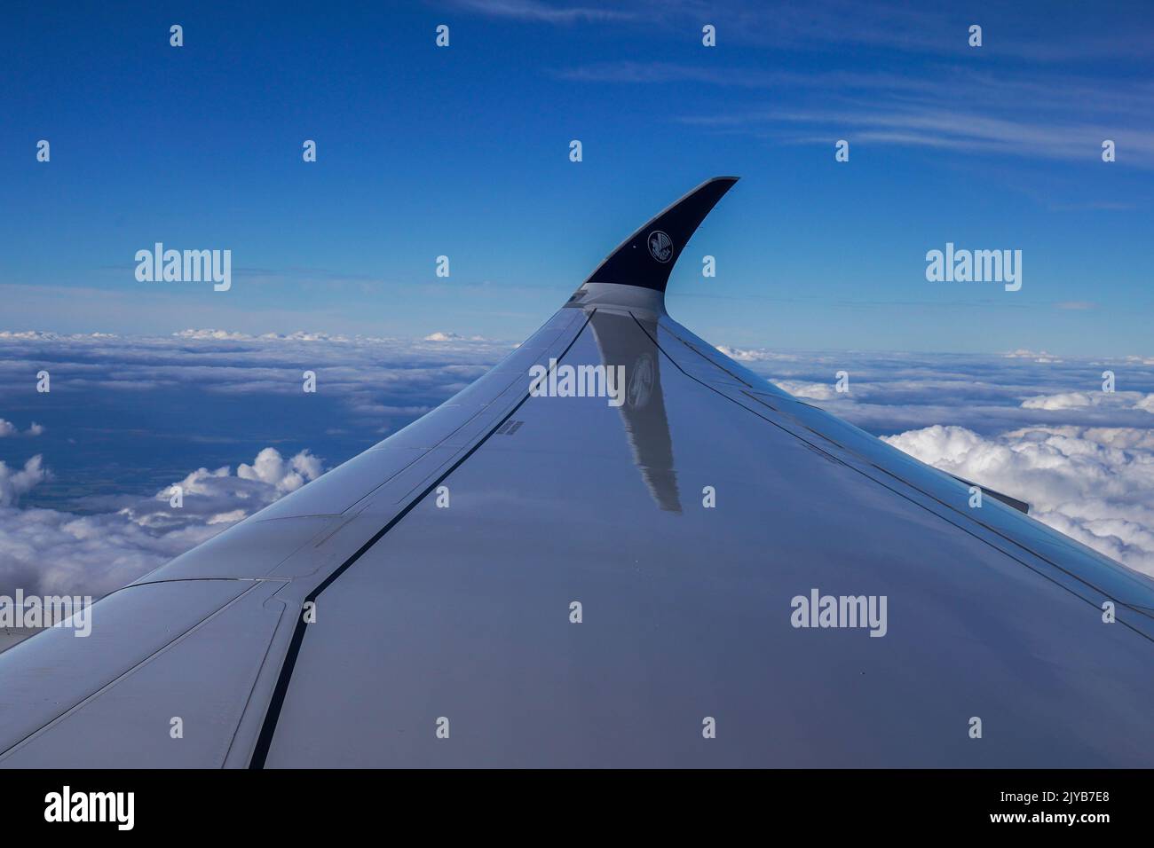 Passenger plane flying over Europe Stock Photo