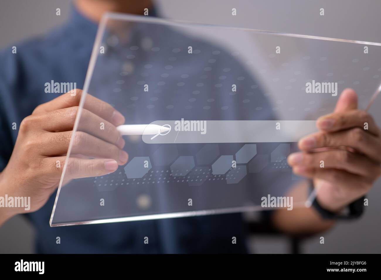 Search Engine Optimization using Data Search Technology. A man's use tablet searching for information. Using Search Console to help you with your webs Stock Photo