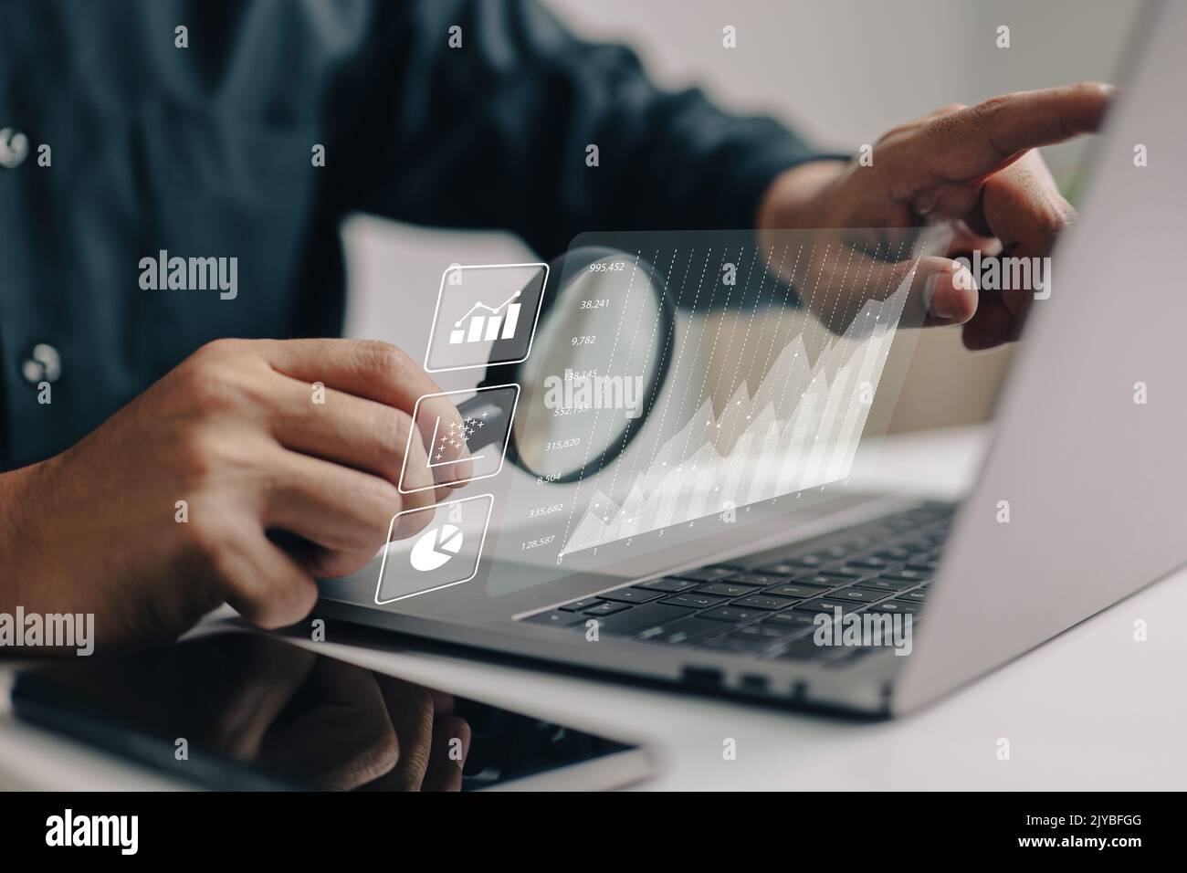 The analyses of large amounts of data and the idea of business intelligence. Charts of the company finances are displayed on a screen that is simulate Stock Photo