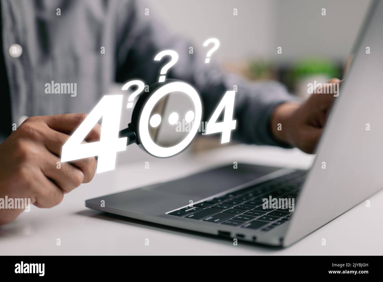 A guy checks an error 404, page not found, online service notice message on a website using a magnifying glass and question marks. Stock Photo