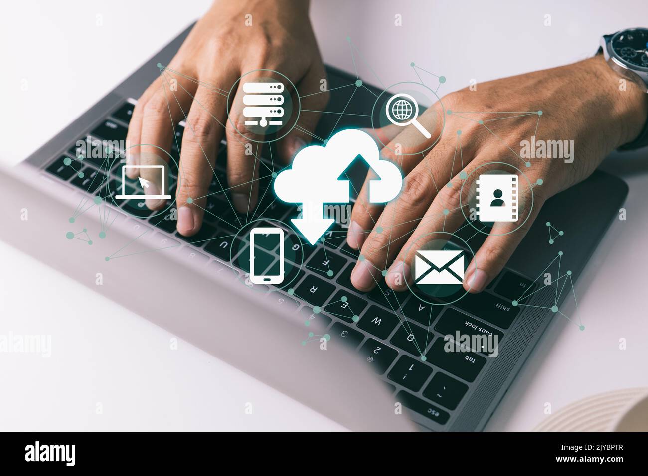 A individual utilizing a laptop computer is using cloud computing. Stock Photo