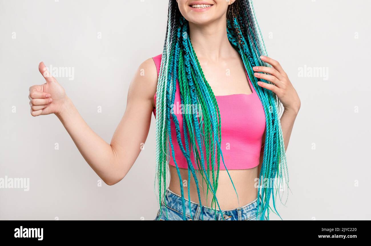 millennial gen woman blue hair braids like gesture Stock Photo