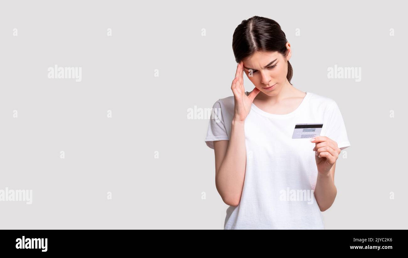 bank debt financial insecurity woman credit card Stock Photo