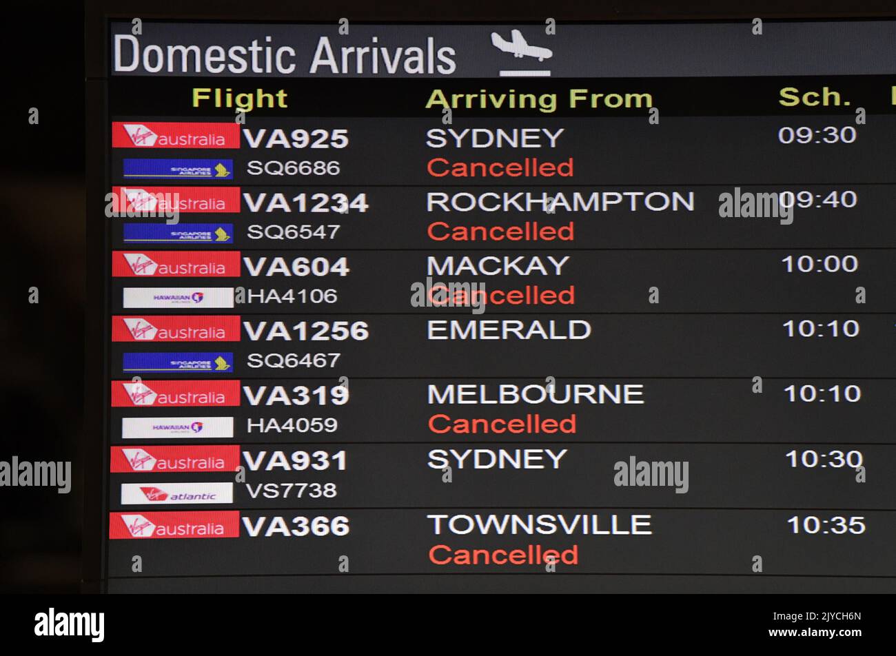 a-domestic-arrivals-board-showing-cancelled-flights-is-seen-at-the