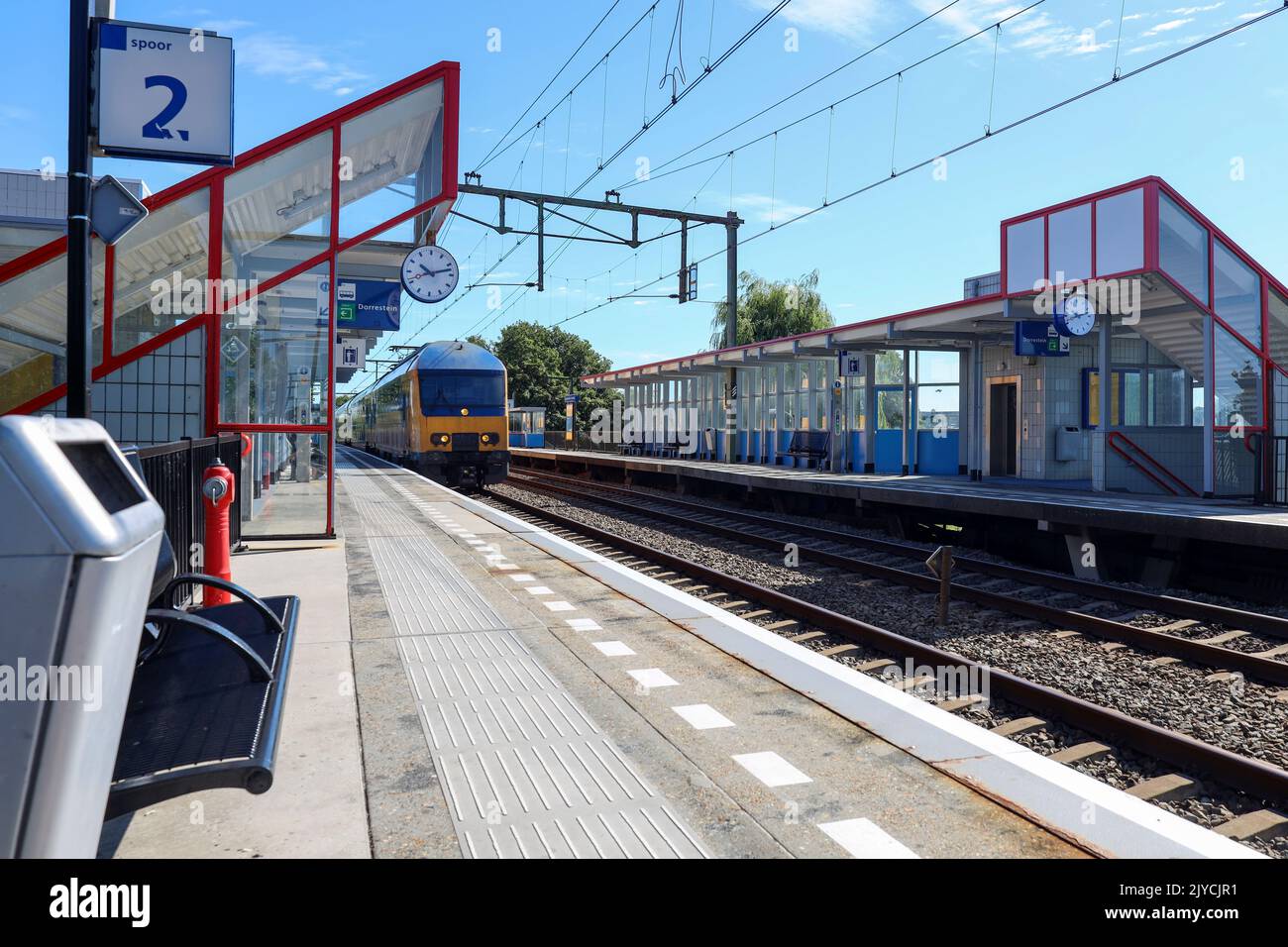 DDAZ double decker train rushes along station Nieuwerkerk aan den IJssel in the Netherlands Stock Photo