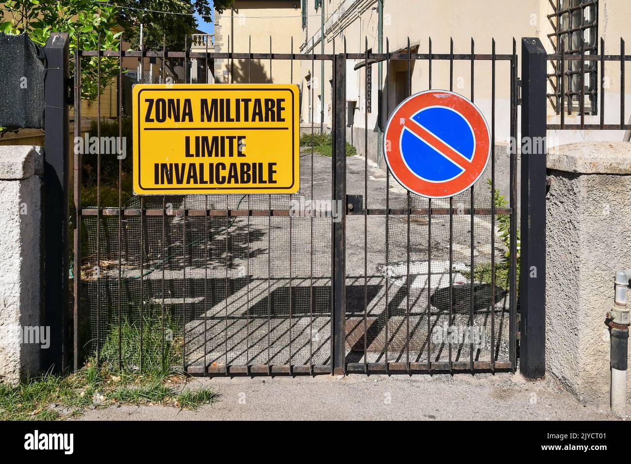 Access ban signs for military zone on the gate of the Carabinieri station, Castiglione della Pescaia, Grosseto, Tuscany, Italy Stock Photo