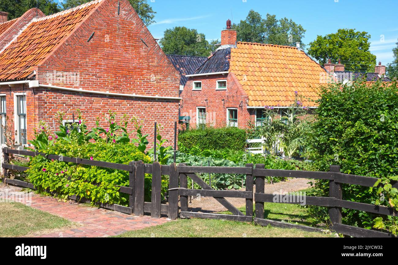 Very old houses with red roofs in the Netherlands Stock Photo