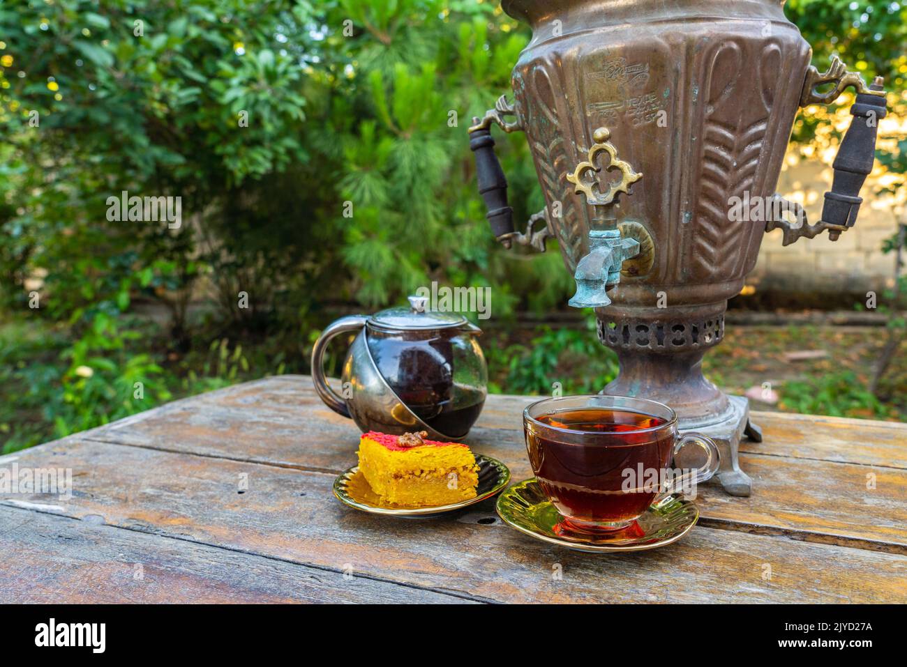 Tea drinking from a vintage samovar with oriental sweets Stock Photo ...