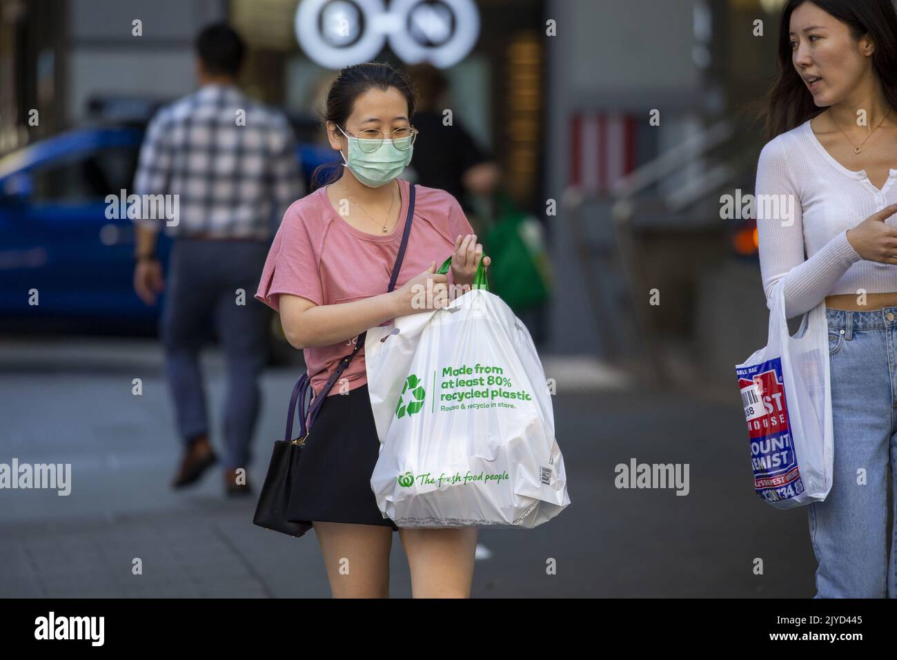 A shopper is seen wearing a mask in Brisbane, Friday, May 1, 2020. (AAP