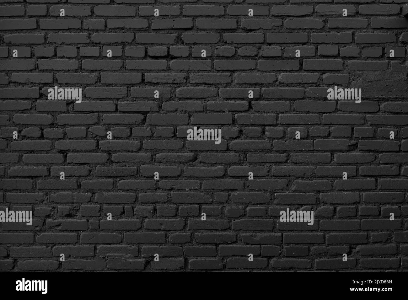 Black brick wall background. Dark brickwork. Copy space. High quality