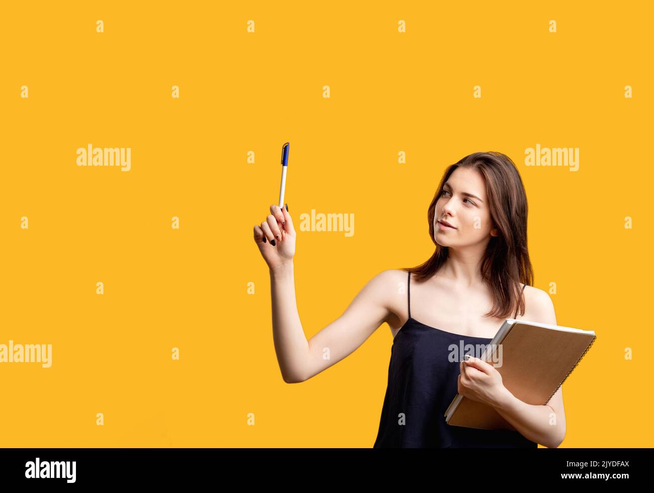 advertising message follow us woman pointing pen Stock Photo